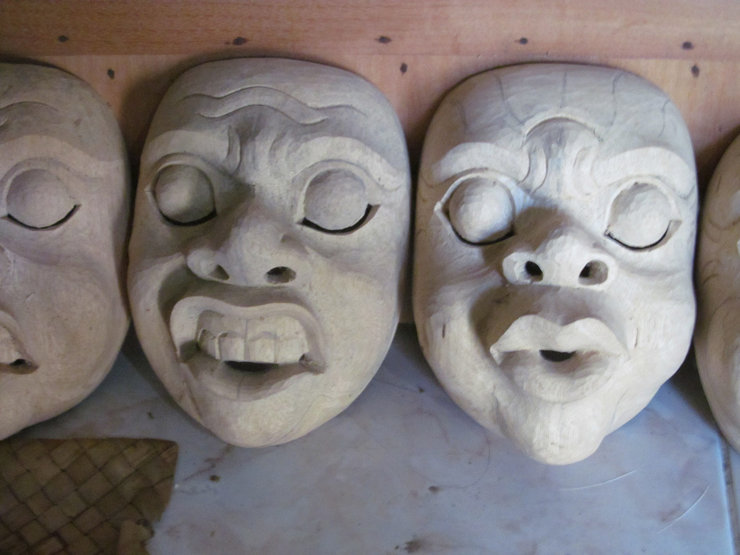 Unpainted masks in Nyoman's studio.