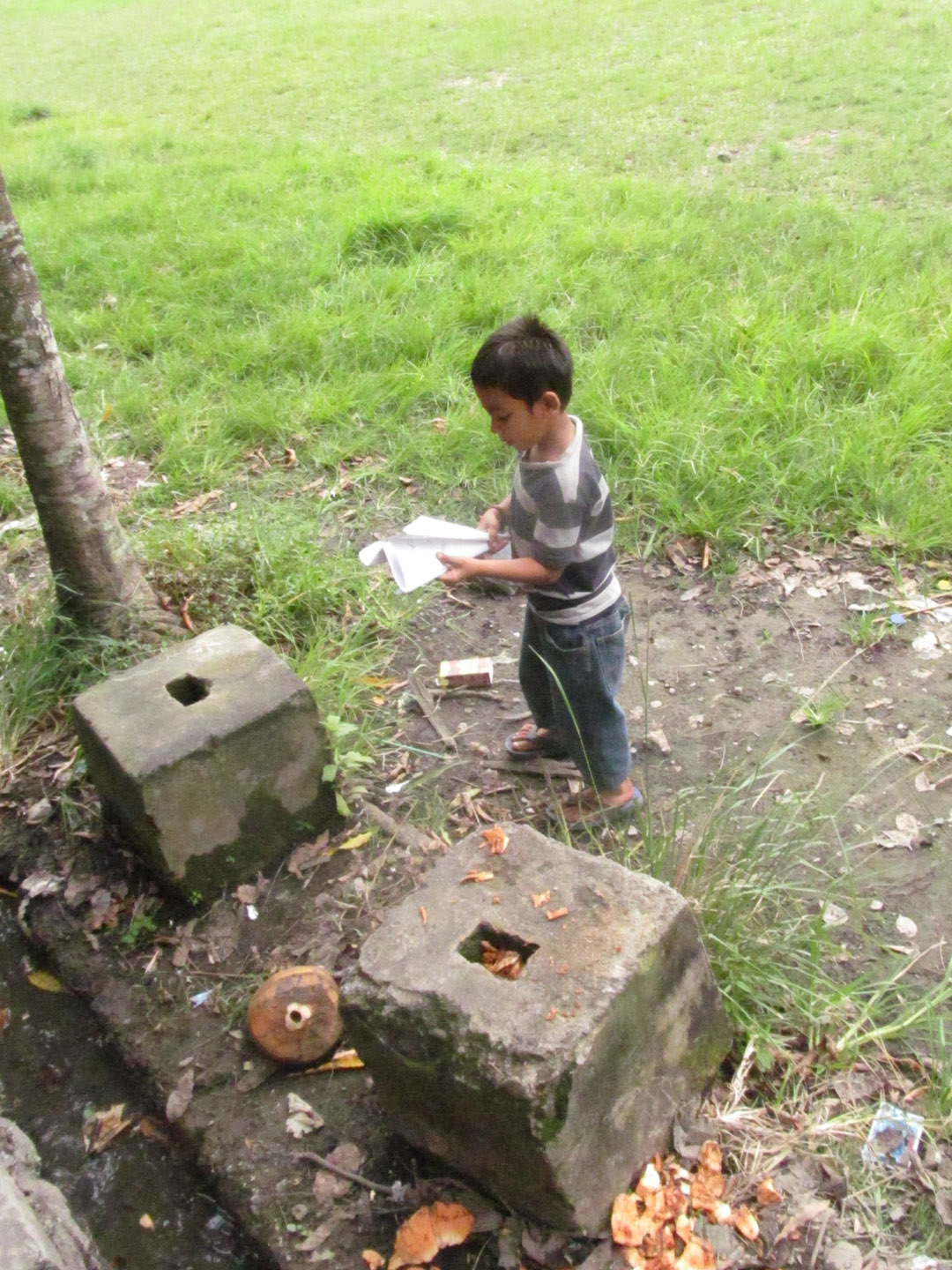This is the coolest kid ever. His mother runs the warung near the library where we carve some days, and he would frequently come inside to try on our masks, play on the gamelan, or climb Spencer.