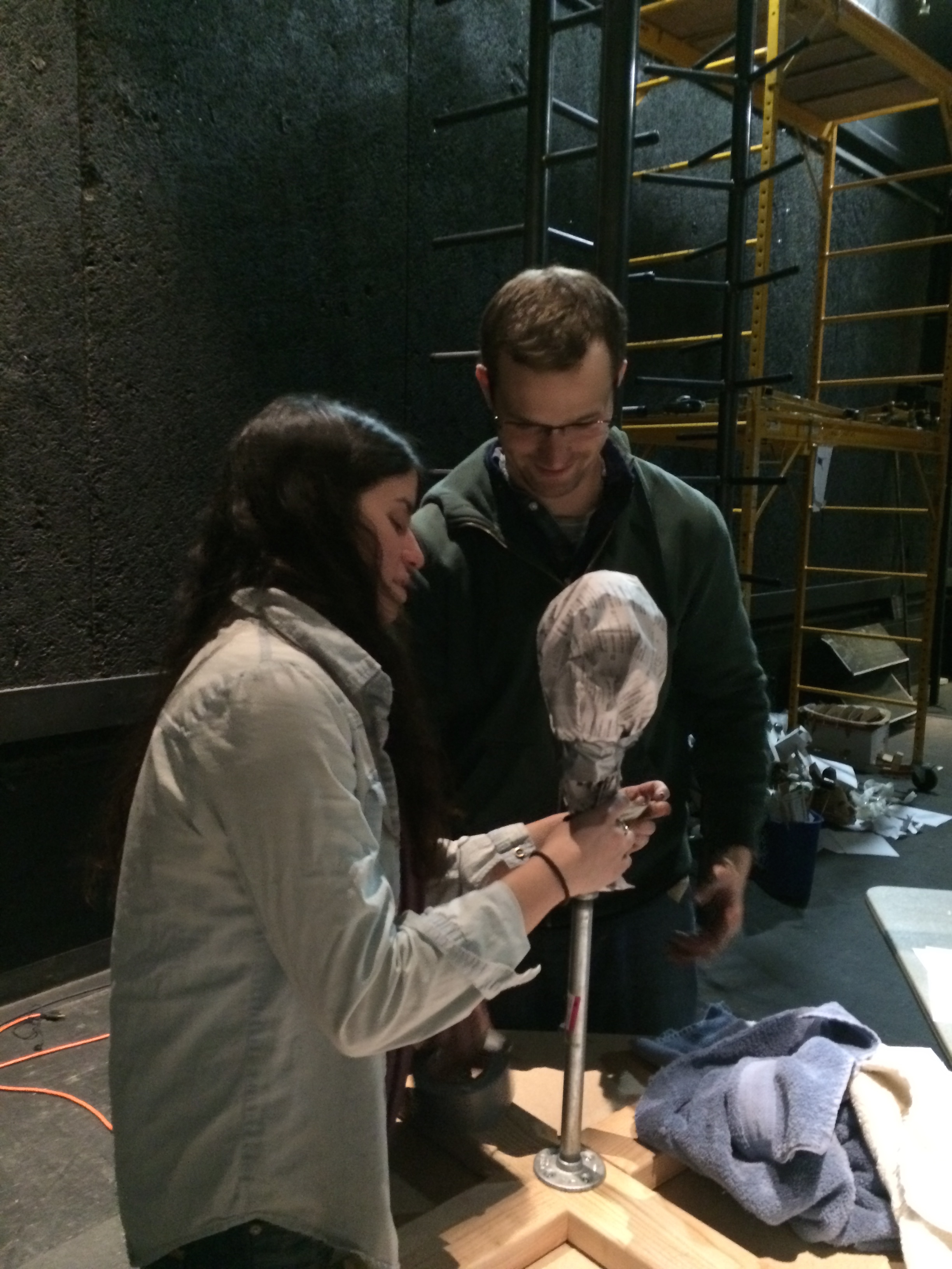 The actors made a ball of paper the size of their head and attached it to the armature stand. This helps them size the mask correctly.