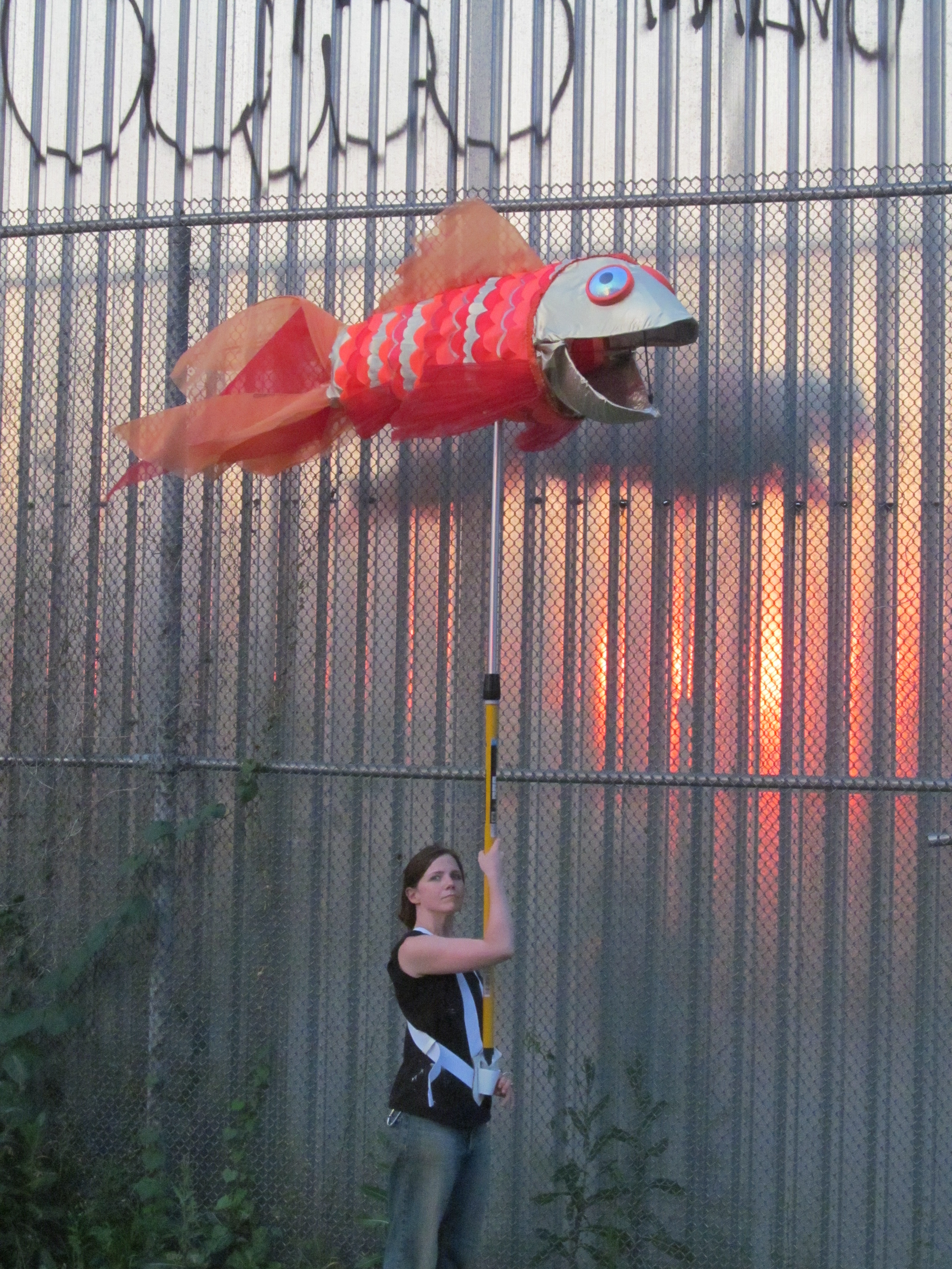 Checking the puppet at the studio at sunset. 