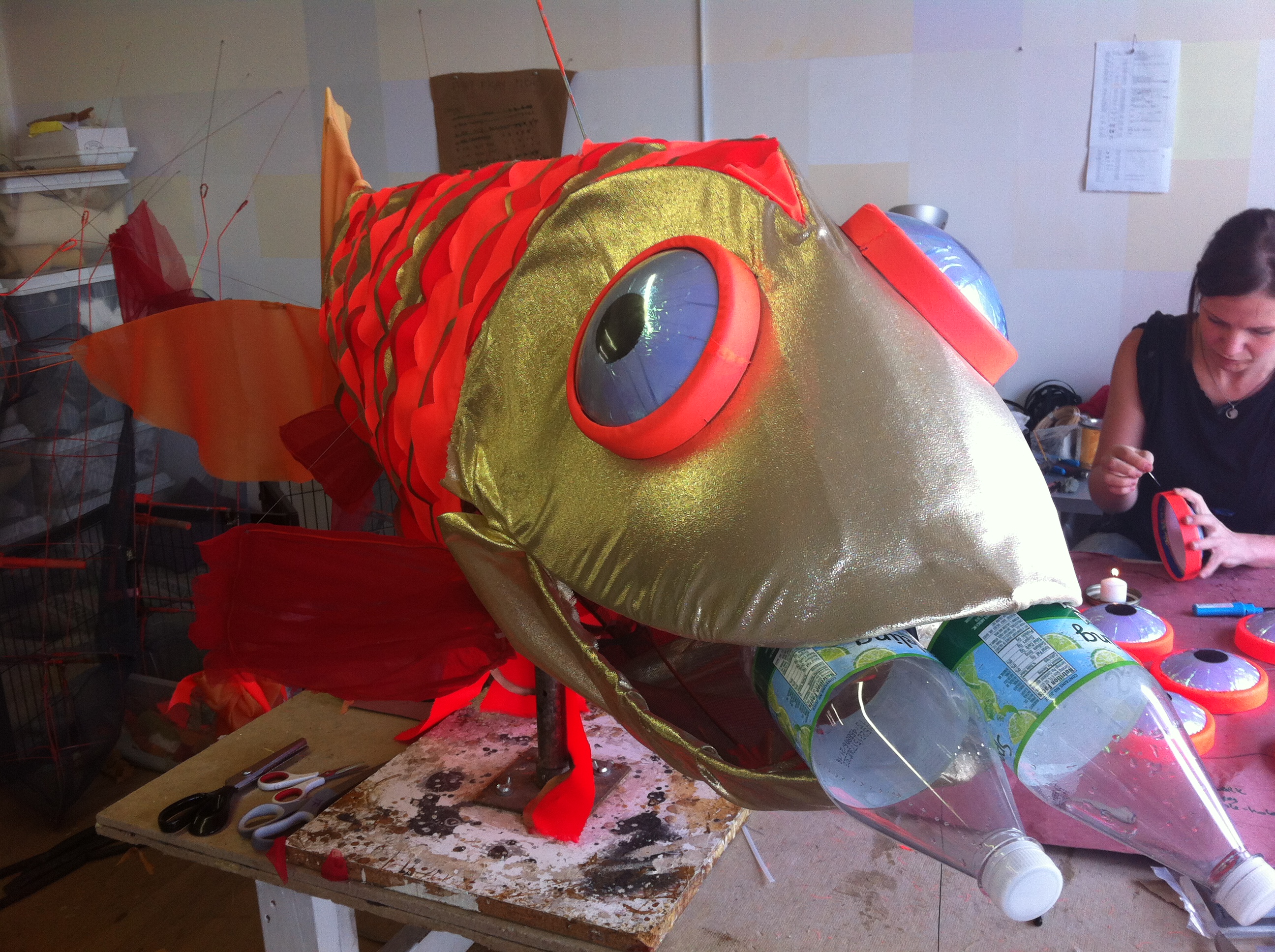 Finishing the attachment of the gold lamé  around the mouth. It was a thirsty sort of day.